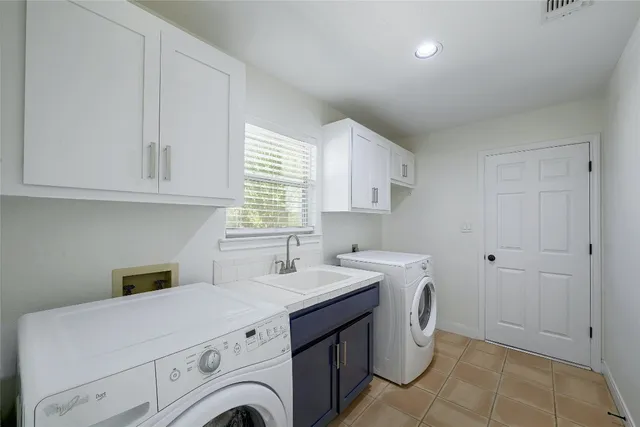 a backyard of a house with fire pit and outdoor seating