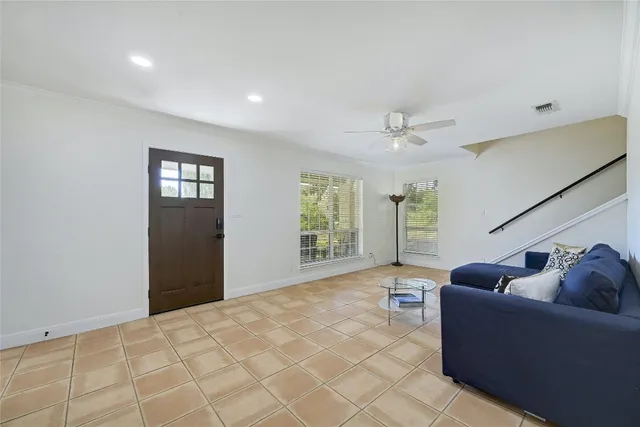 a living room with furniture and window