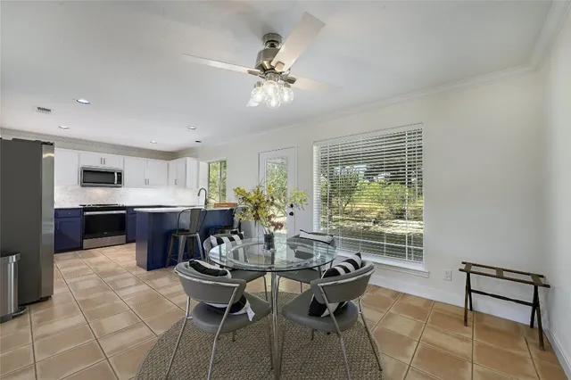 a dining room with furniture and window