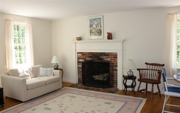75 Herring River Road Wellfleet, MA 02667 - Photo 8 of 15 a living room with furniture and a fireplace