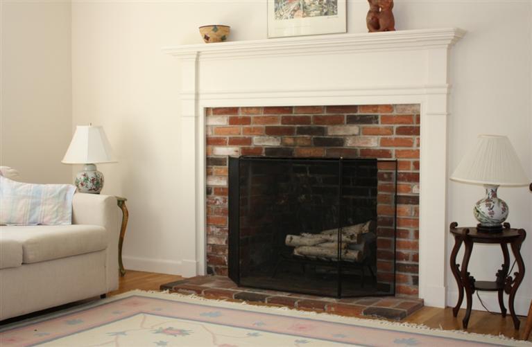 75 Herring River Road Wellfleet, MA 02667 - Photo 9 of 15 a living room with furniture and a fireplace
