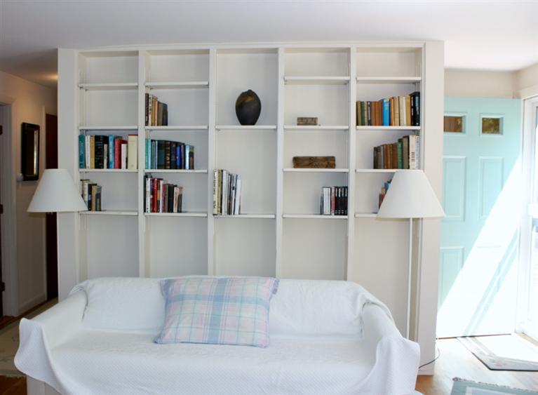 75 Herring River Road Wellfleet, MA 02667 - Photo 10 of 15 a living room with furniture and a book shelf