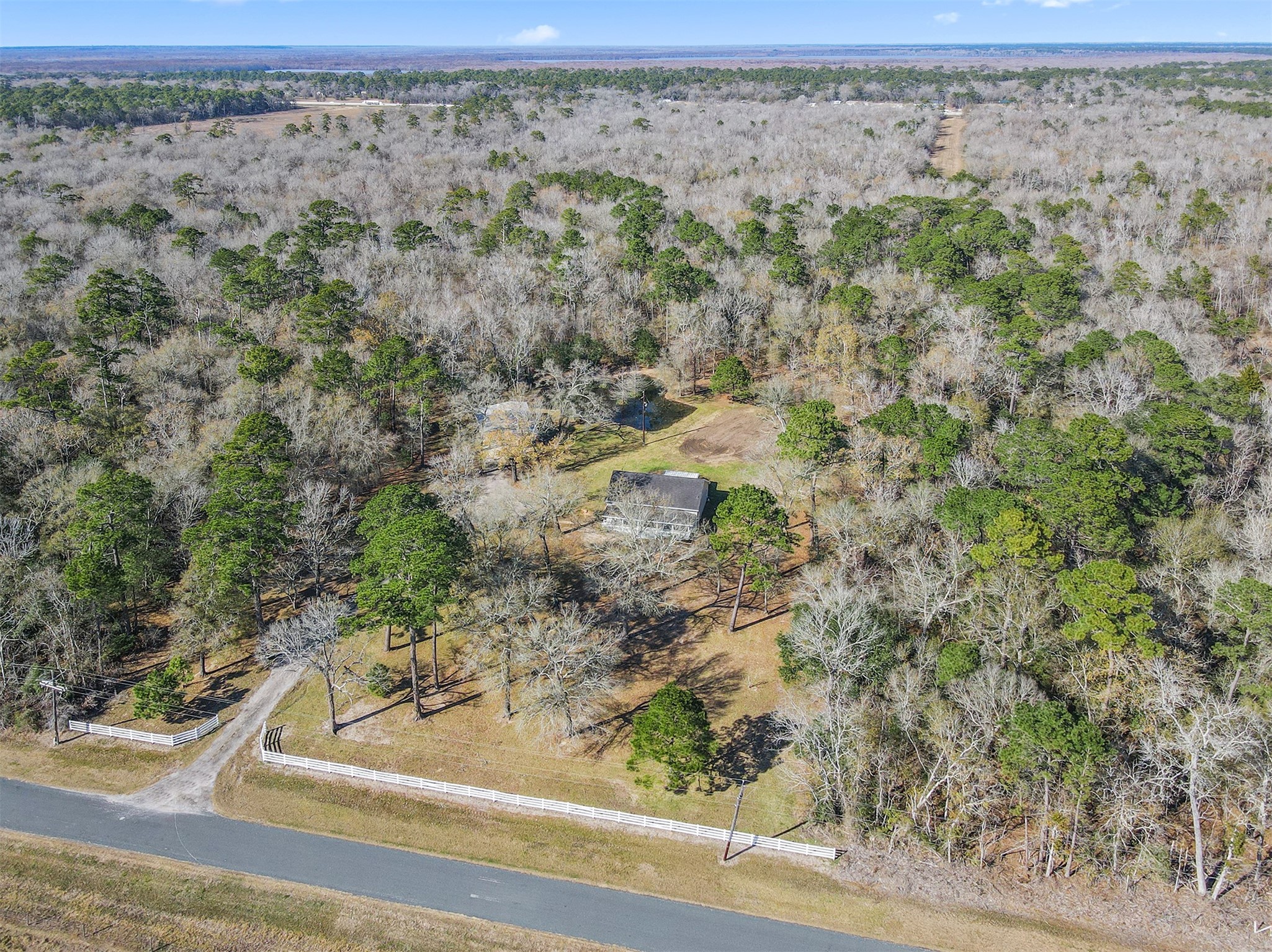 1635 Wallisville-Turtle Bayou Road Wallisville, TX 77597 - Photo 15 of 46 a view of a yard with wooden fence
