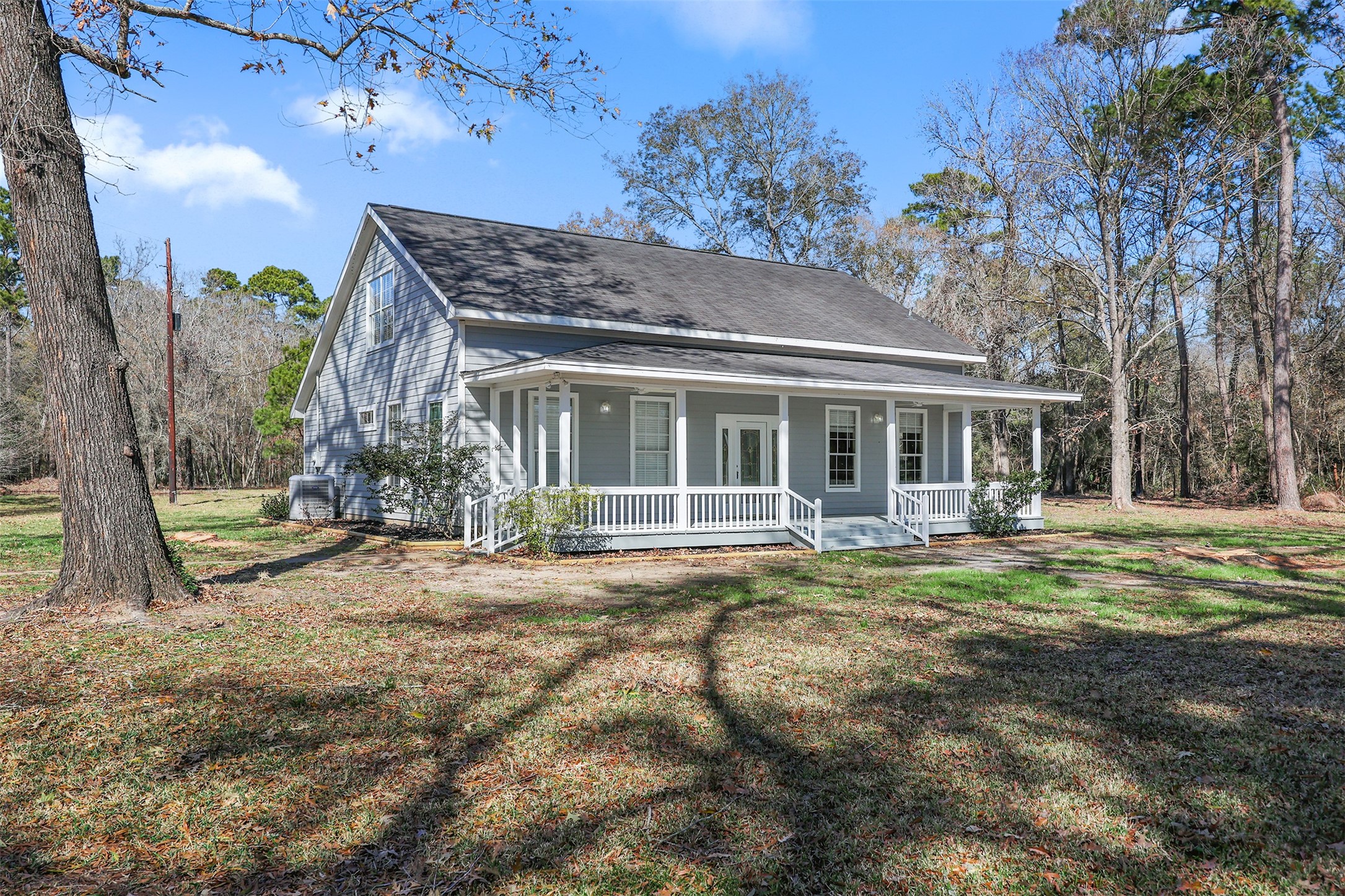 1635 Wallisville-Turtle Bayou Road Wallisville, TX 77597 - Photo 3 of 46 a front view of a house with a garden