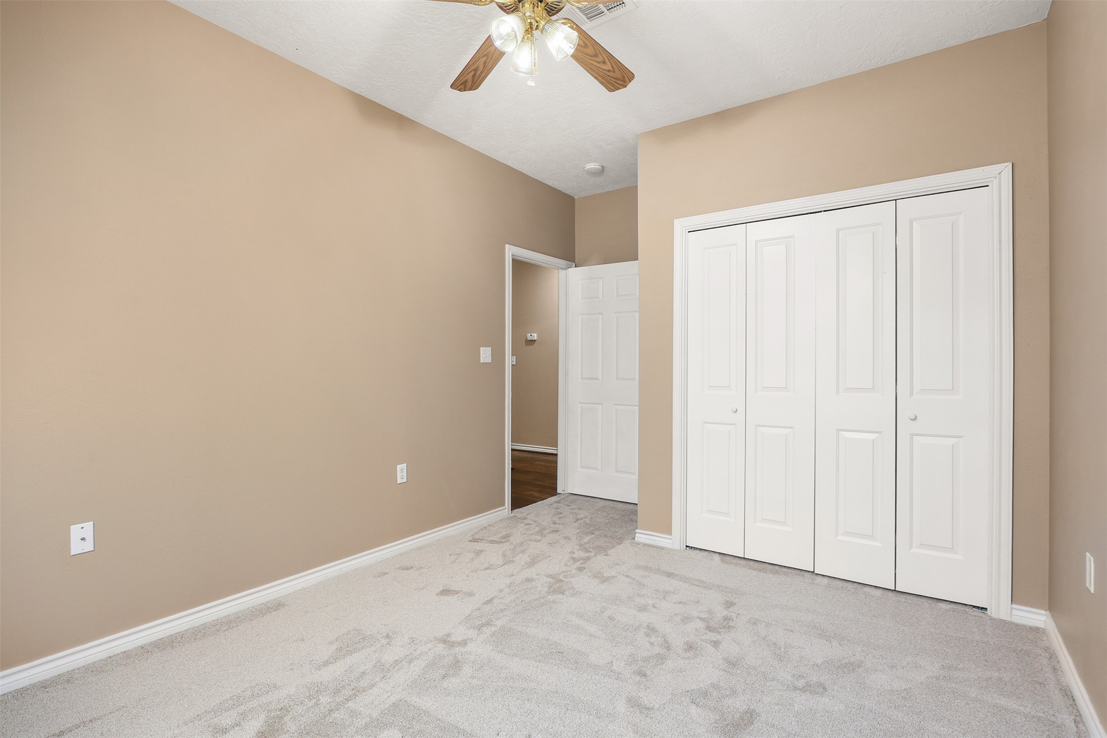 1635 Wallisville-Turtle Bayou Road Wallisville, TX 77597 - Photo 31 of 46 an empty room with fan and entrance