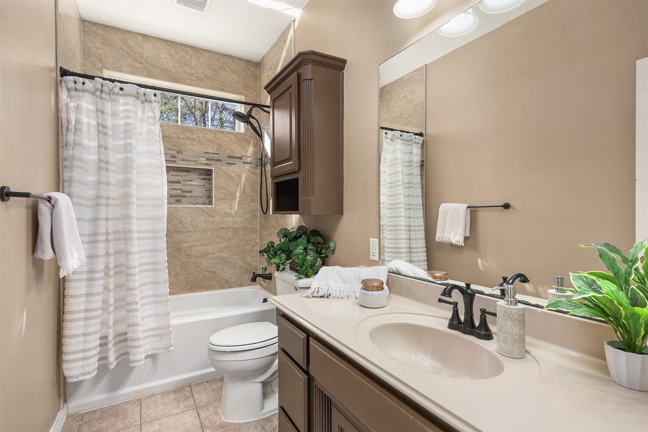 1635 Wallisville-Turtle Bayou Road Wallisville, TX 77597 - Photo 33 of 46 a bathroom with a granite countertop sink toilet a mirror a vanity and shower