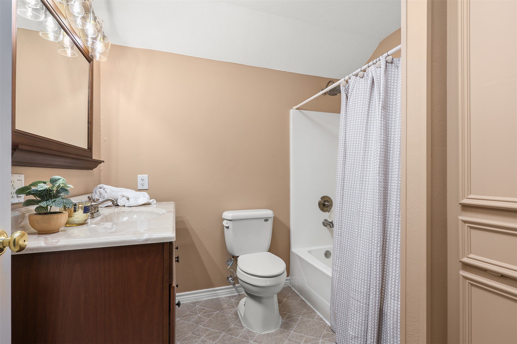1635 Wallisville-Turtle Bayou Road Wallisville, TX 77597 - Photo 39 of 46 a bathroom with a sink a toilet and shower curtain