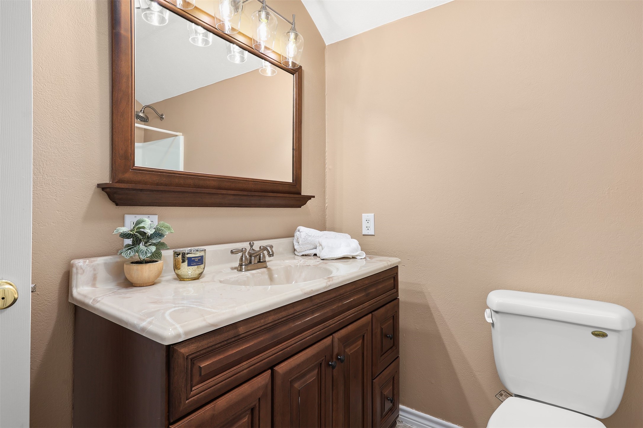 1635 Wallisville-Turtle Bayou Road Wallisville, TX 77597 - Photo 40 of 46 a bathroom with a granite countertop sink and a toilet