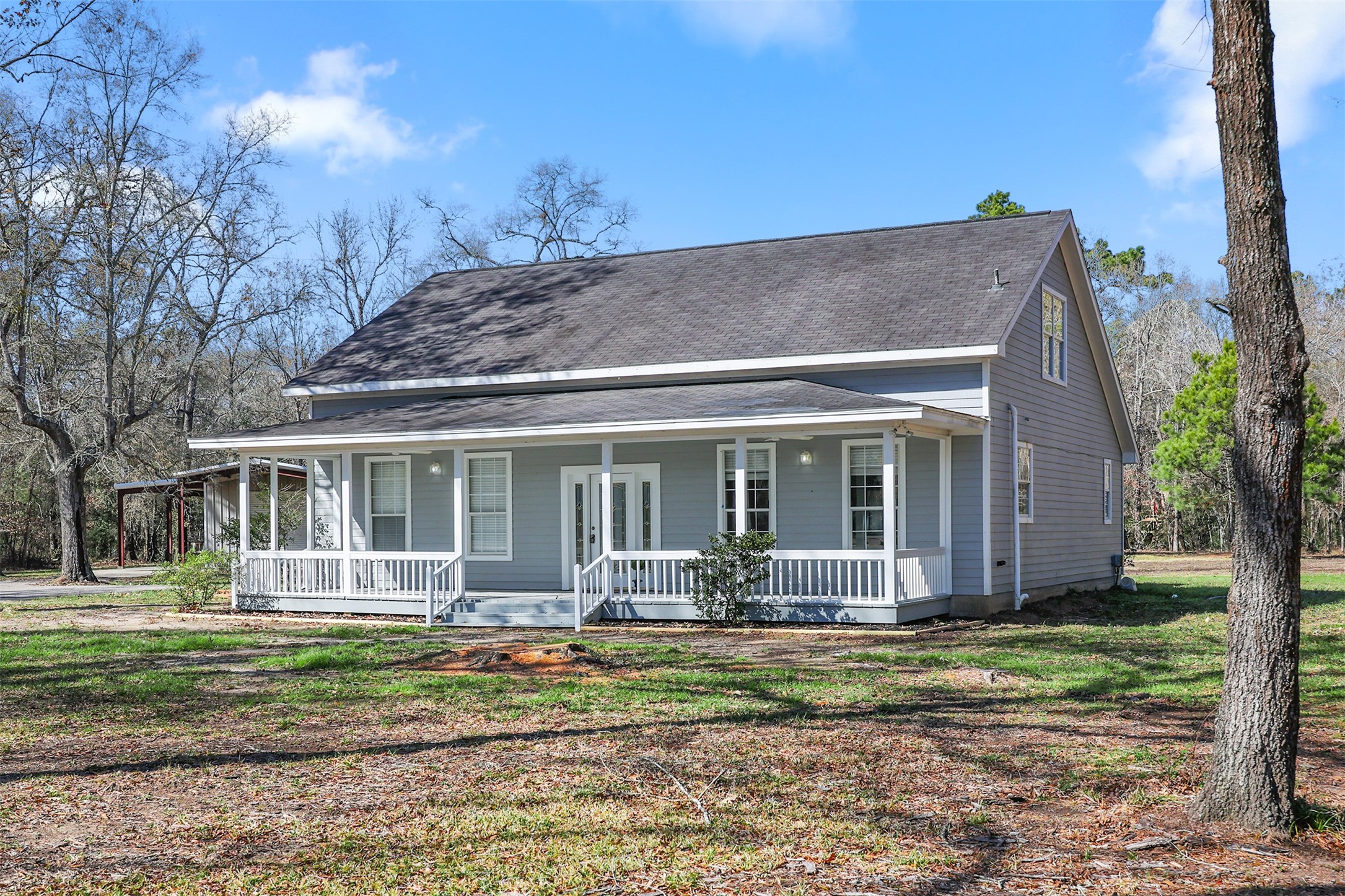 1635 Wallisville-Turtle Bayou Road Wallisville, TX 77597 - Photo 4 of 46 front view of a house with a yard
