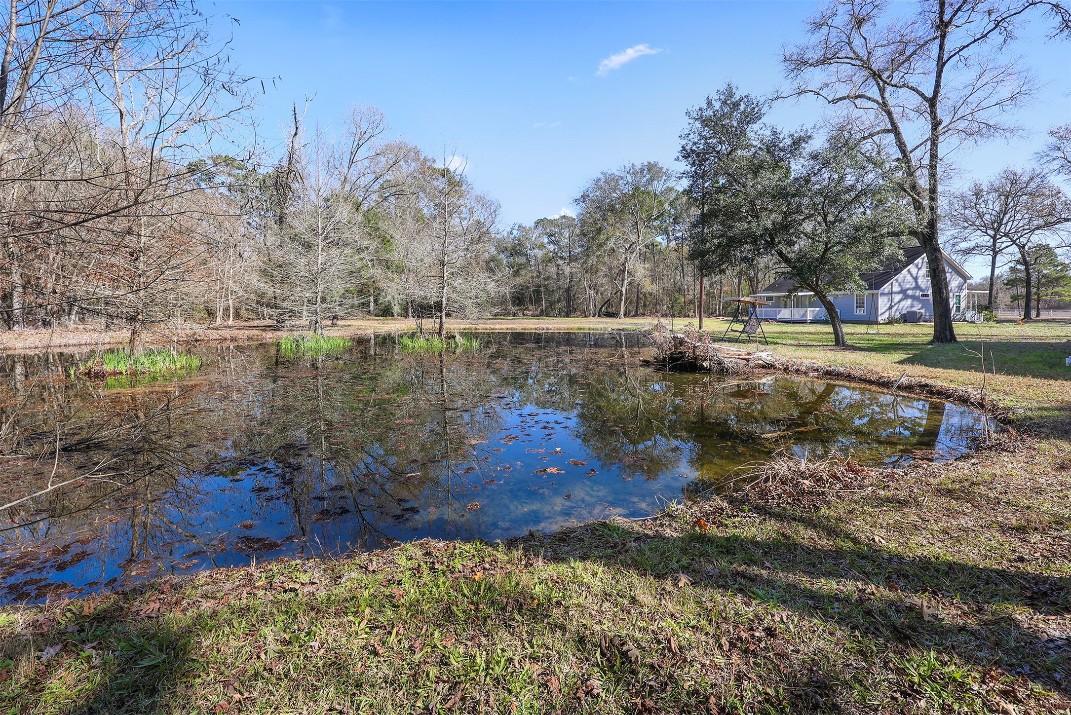1635 Wallisville-Turtle Bayou Road Wallisville, TX 77597 - Photo 9 of 46 a view of a lake with a yard