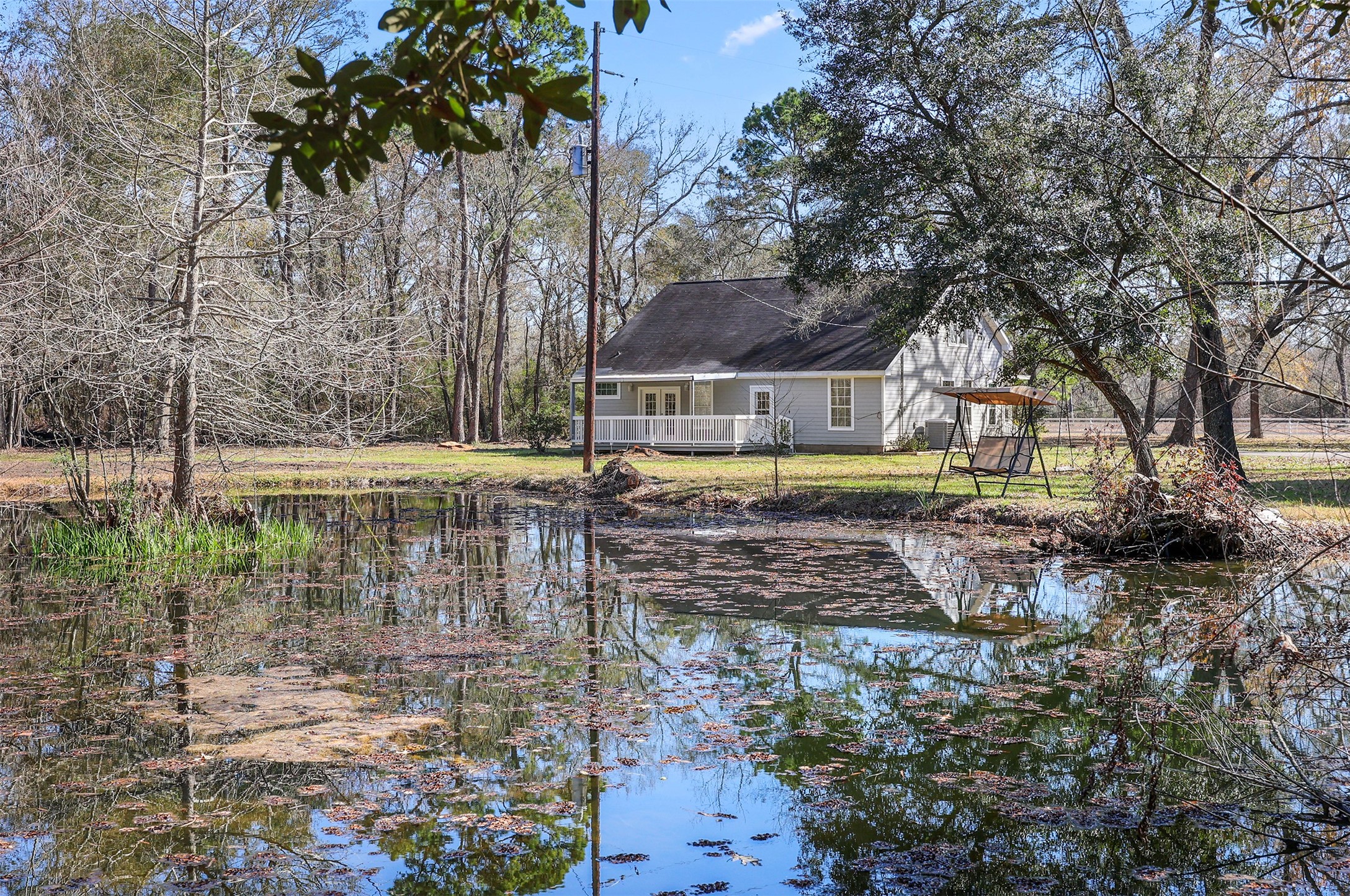 1635 Wallisville-Turtle Bayou Road Wallisville, TX 77597 - Photo 10 of 46 a view of a yard with plants and large trees