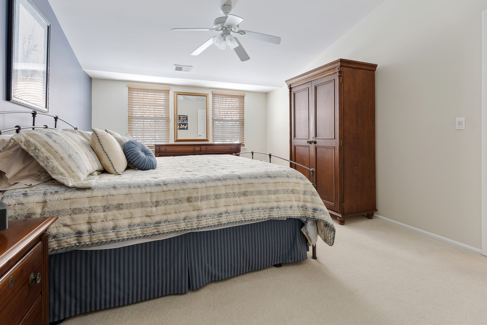 1600 Brittany Court, Unit C2 Wheeling, IL 60090 - Photo 12 of 27 a bedroom with a bed dresser and wooden floor
