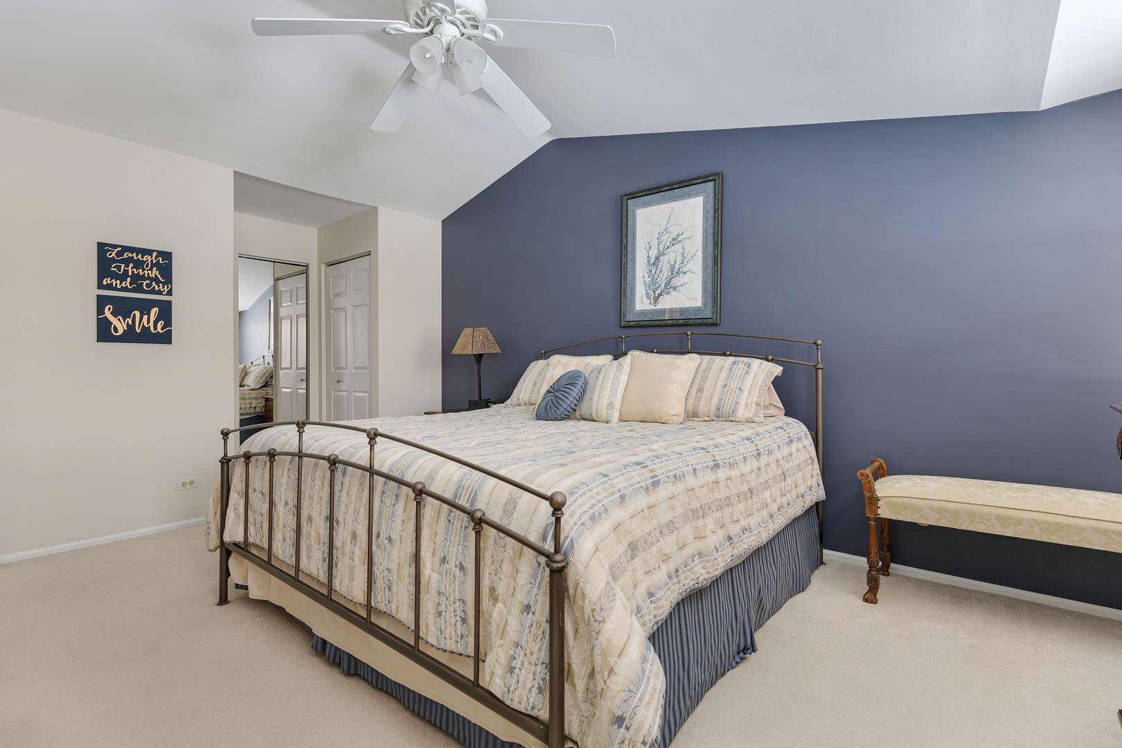 1600 Brittany Court, Unit C2 Wheeling, IL 60090 - Photo 13 of 27 a bedroom with a bed and a chandelier