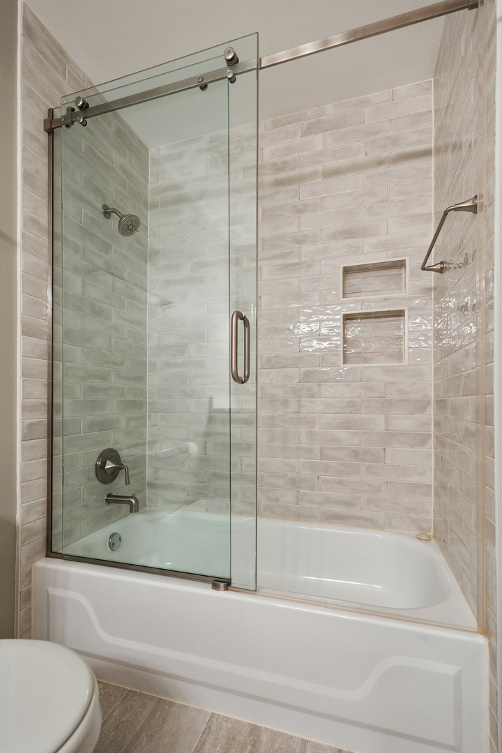 1600 Brittany Court, Unit C2 Wheeling, IL 60090 - Photo 19 of 27 a bathroom with a shower and a toilet