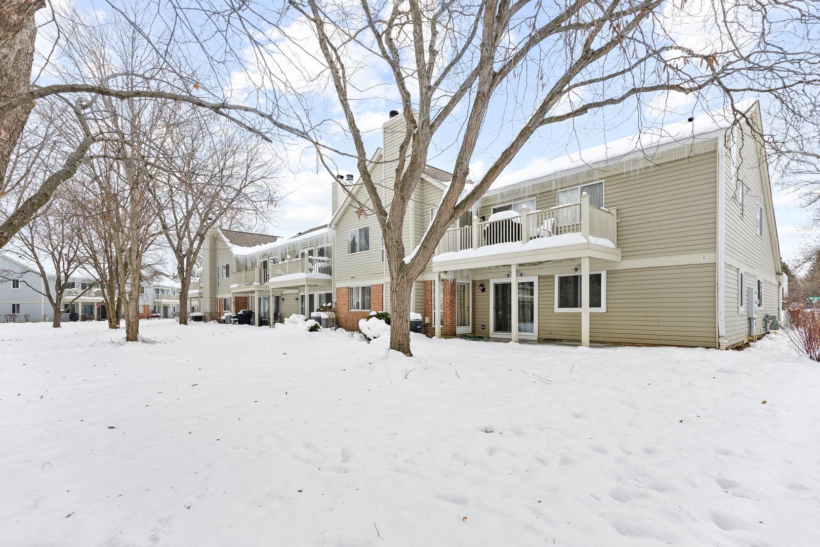 1600 Brittany Court, Unit C2 Wheeling, IL 60090 - Photo 23 of 27 a view of a covered with snow in the yard