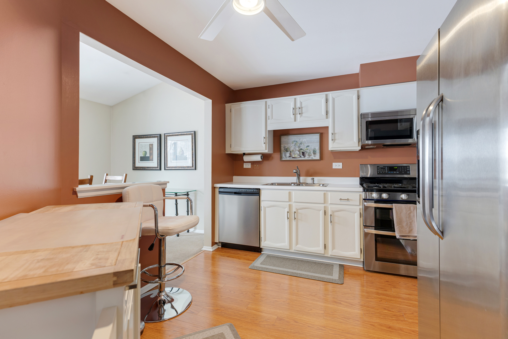 1600 Brittany Court, Unit C2 Wheeling, IL 60090 - Photo 6 of 27 a kitchen with a sink appliances and cabinets
