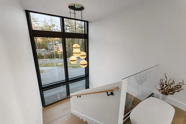 a white bath tub sitting in a bathroom next to a window