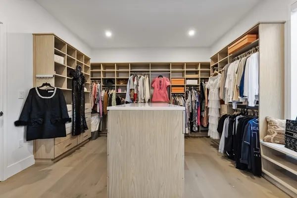 a bedroom with a bed and a large window with outer view