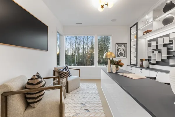 a tennis court with view of trees in the background