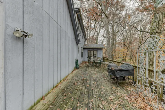 a backyard of a house with outdoor seating