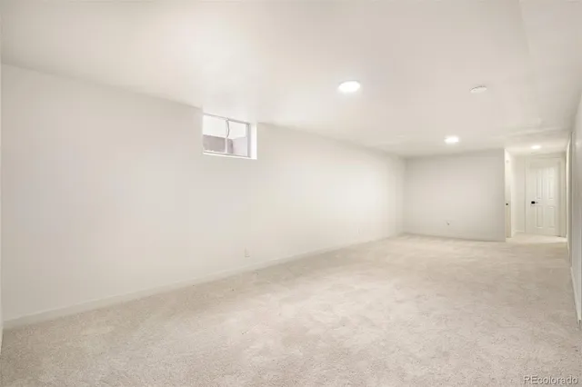 an empty room with a empty space and windows