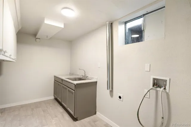 a bathroom with a granite countertop sink a vanity and a mirror
