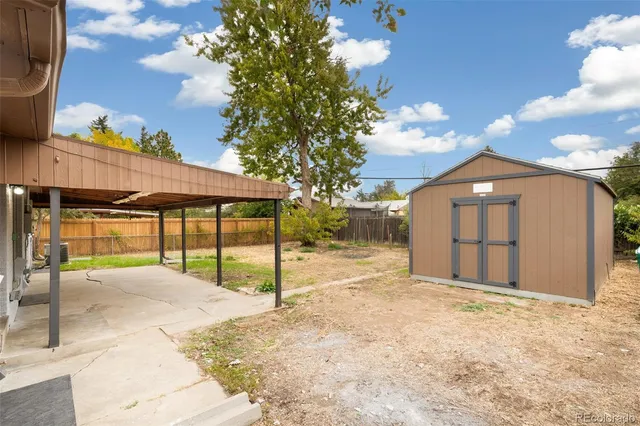 a view of a house with a yard and garage