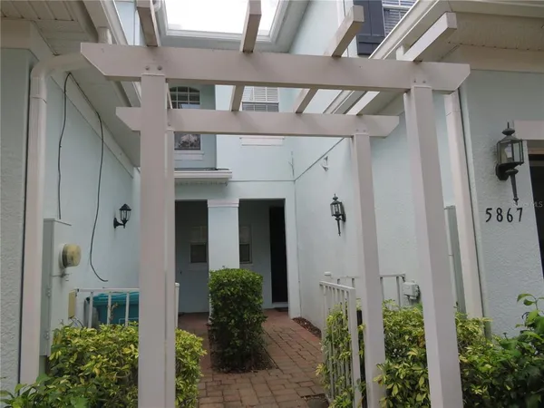 a front view of a house with a plants