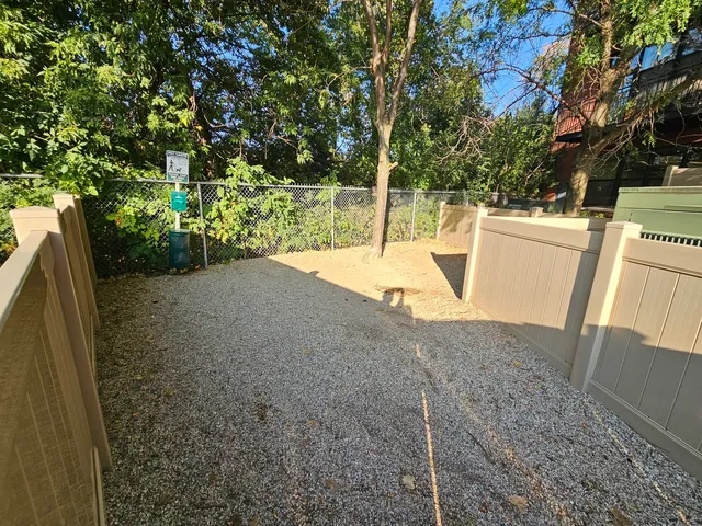 an aerial view of a city with lawn chairs