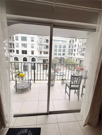 a view of living room with furniture and floor to ceiling window