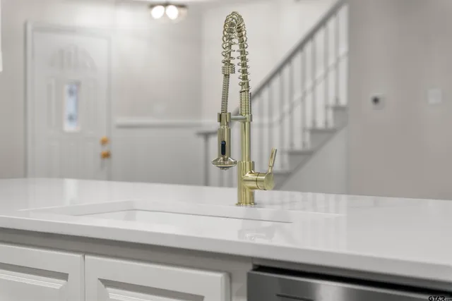 a bathroom with a sink and mirror