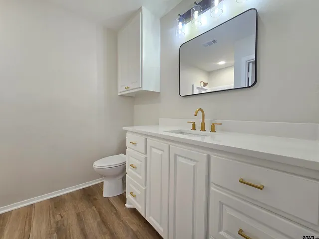 a bathroom with a sink and mirror