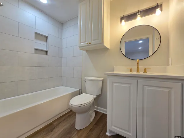 wooden floor in an empty room and a kitchen