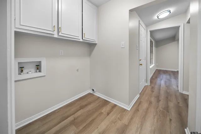 a view of a hallway with a kitchen