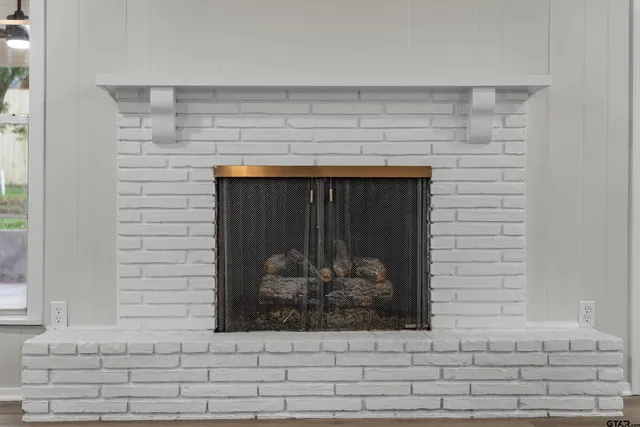 a fireplace with a potted plant