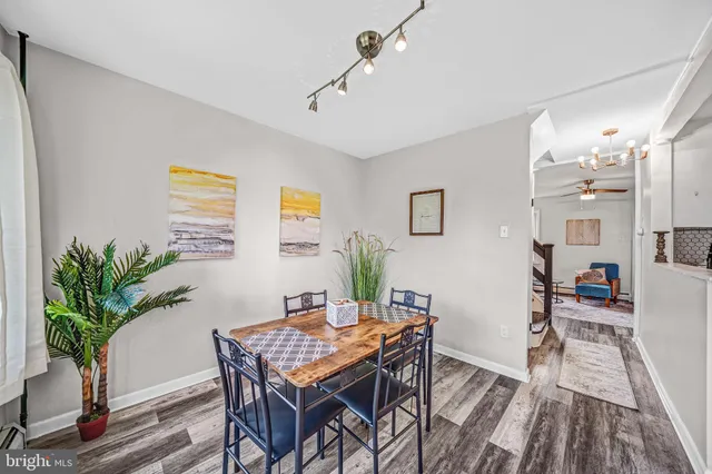 a view of a livingroom with furniture and a potted plant