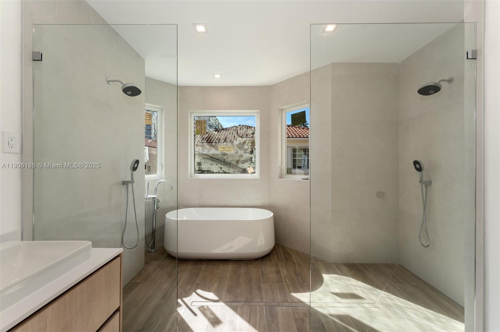 3944 194th Trail Sunny Isles Beach, FL 33160 - Photo 5 of 20 a spacious bathroom with a bathtub and shower