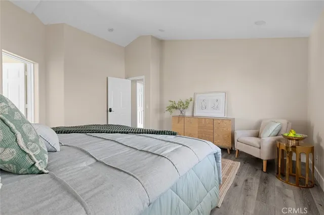 a spacious bathroom with a granite countertop tub sink a mirror a shower and vanity