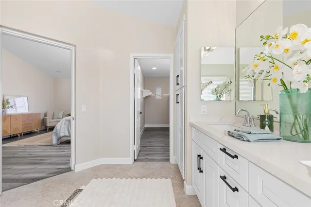 a view of a hallway with wooden floor and windows