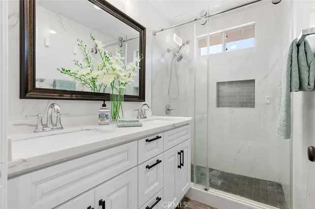 a view of a hallway with a white walls and a window