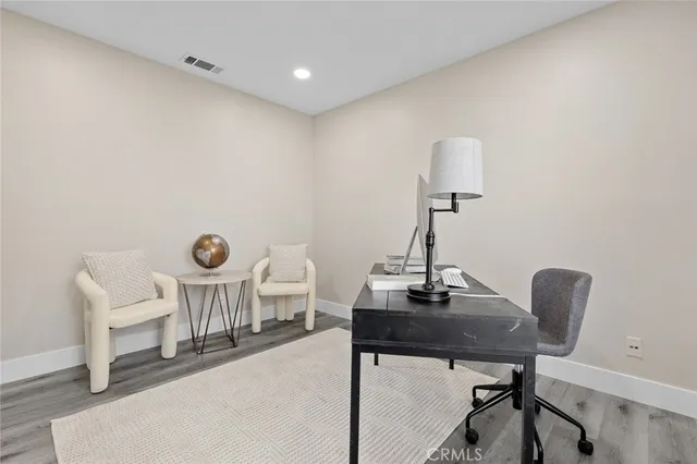 a view of an entryway with wooden floor