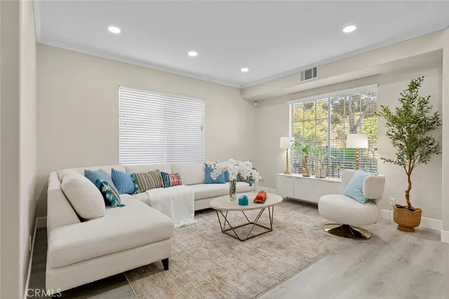 a bathroom with a sink a toilet and a window