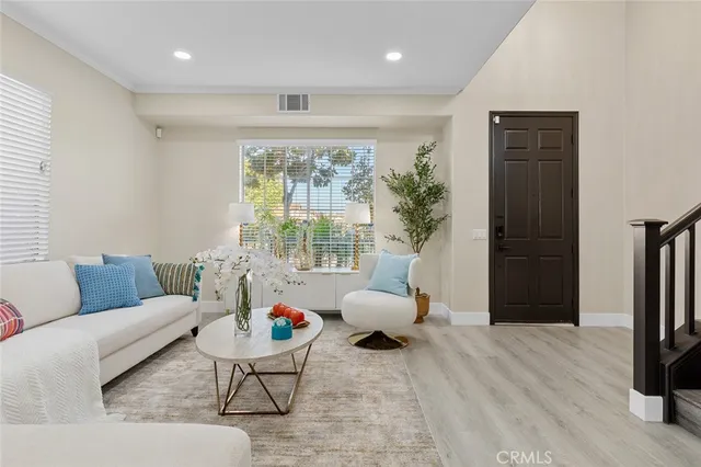 a bathroom with a toilet a sink and a window