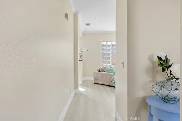 a spacious bedroom with a bed and a large window