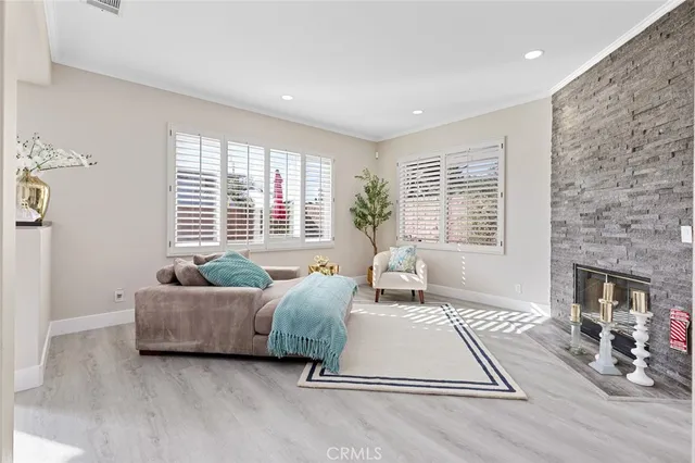 a dining room with furniture and a chandelier