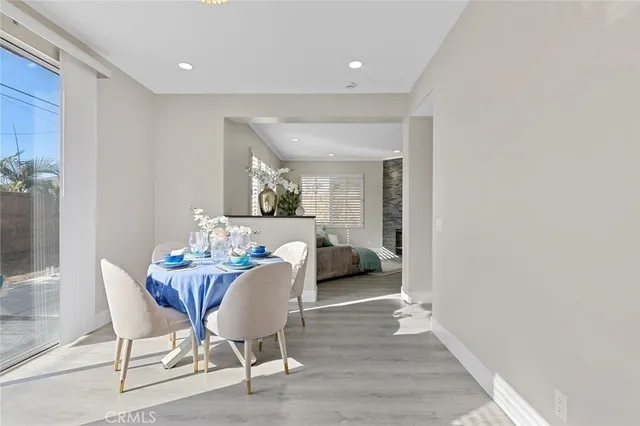 a kitchen with stainless steel appliances kitchen island granite countertop a refrigerator and a sink