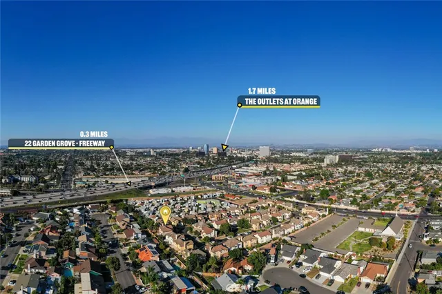 an aerial view of a houses with a swimming pool