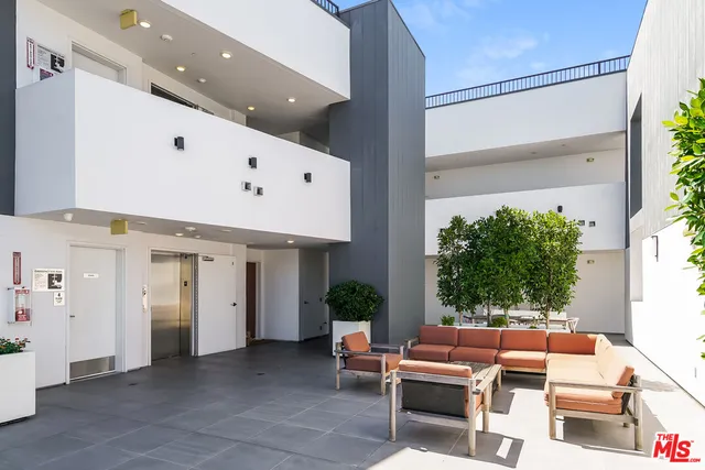 a outdoor space with patio furniture and potted plants