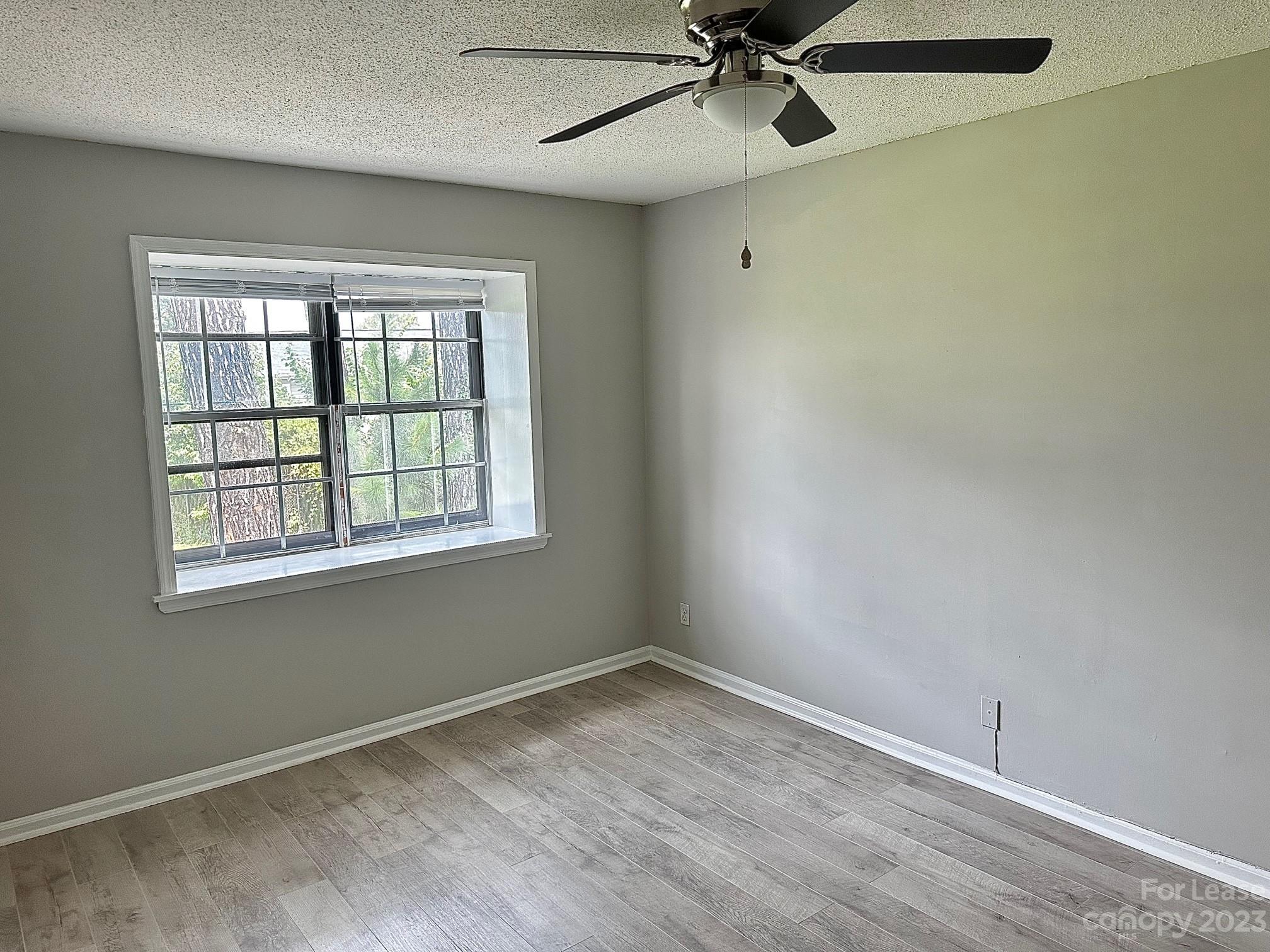 5805 Hunting Ridge Lane Charlotte, NC 28212 - Photo 5 of 7 a view of an empty room with a window