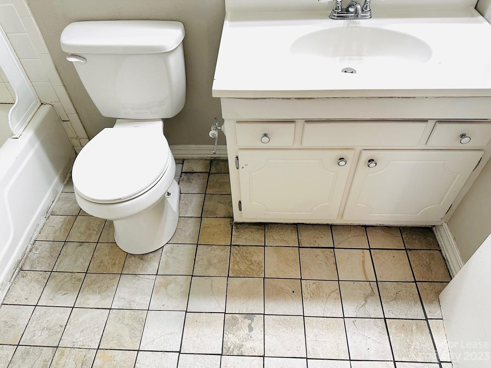 5805 Hunting Ridge Lane Charlotte, NC 28212 - Photo 7 of 7 a bathroom with a toilet and a sink